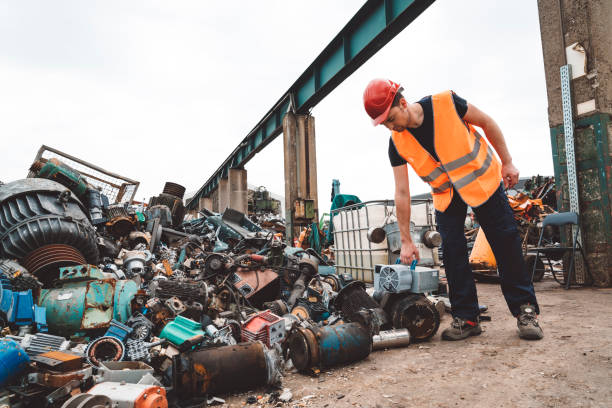 Metal dump and a worker سكراب بالرياض برق الرياضmoving the سكراب بالرياض برق الرياضmetal